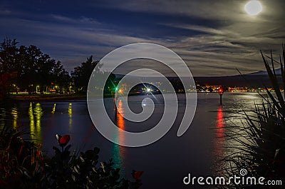 Full moon setting at dawn Stock Photo