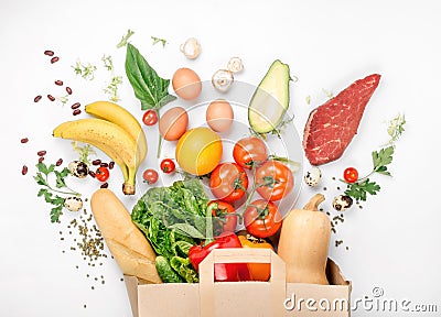 Full paper bag of different health food on white background Stock Photo