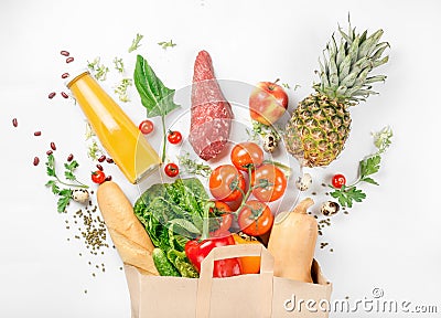 Full paper bag of healthy food on white background Stock Photo