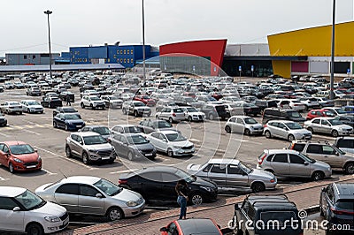 Full parking at the supermarket on a cloudy afternoon Editorial Stock Photo