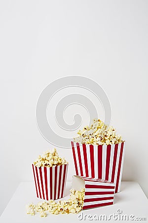 Full of popcorn in classic striped box Stock Photo