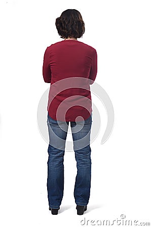 Full portrait of a woman from behind on white, arms crossed Stock Photo