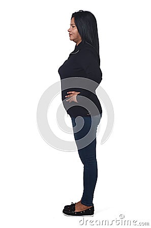 Full portrait of woman sideways on white,arms on hip Stock Photo