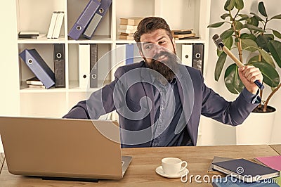 full of rage. frustrated computer user. businessman express anger. ready to smash. Office life makes him crazy. Slow Stock Photo