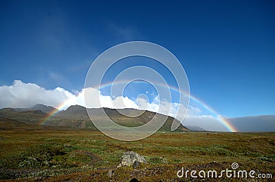 Full rainbow in Iceland Stock Photo