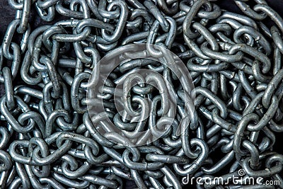 Full screen metal chain. The chain lies chaotically. Stock Photo