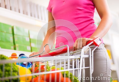 Full shopping cart at supermarket Stock Photo