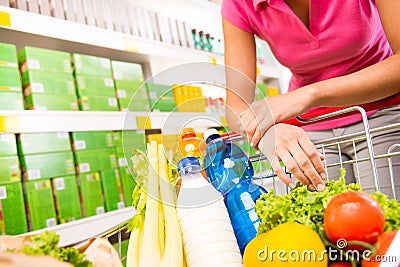 Full shopping cart at supermarket Stock Photo