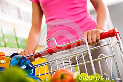 Full shopping cart at supermarket Stock Photo