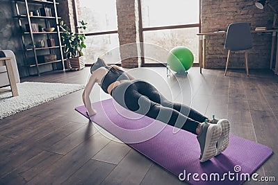 Full size back rear spine view photo of active motivated beautiful sportive girl doing practice yoga aerobics push-up on Stock Photo