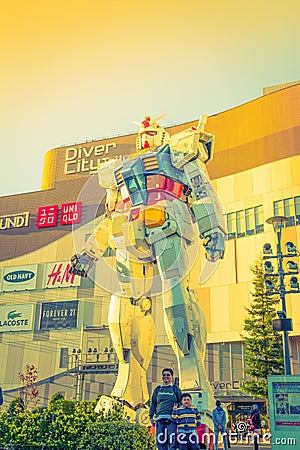 Full size Gundam Performances Outside DiverCity Tokyo Plaza, Odaiba, Tokyo, Japan - 27 November 2015: It is 18m tall The Editorial Stock Photo