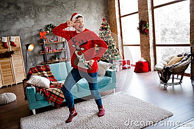 Full size photo of crazy positive person demonstrate v-sign eye dancing christmastime spirit flat indoors Stock Photo