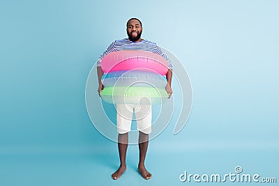 Full size photo of funky funny barefoot afro american guy enjoy weekend have colorful ring float lifesaver buoy ready Stock Photo
