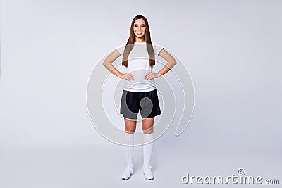 Full size photo of nice sporty lady skilled player soccer women team arms by sides toothy smile wear football uniform t Stock Photo