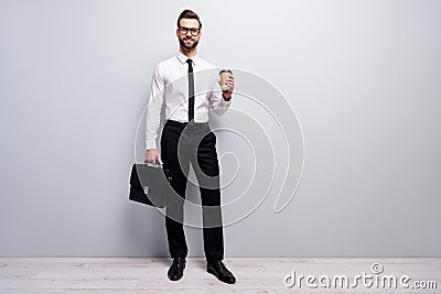 Full size photo positive cool smart freelancer promoter man hold cafeine beverage mug hold modern handbag ready Stock Photo