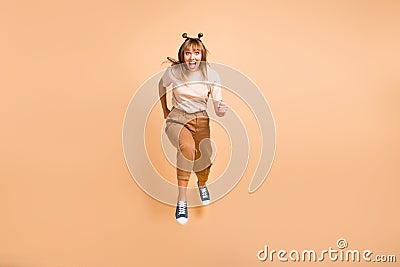 Full size photo of young crazy girl go walk run speed jump up sale isolated over beige color background Stock Photo