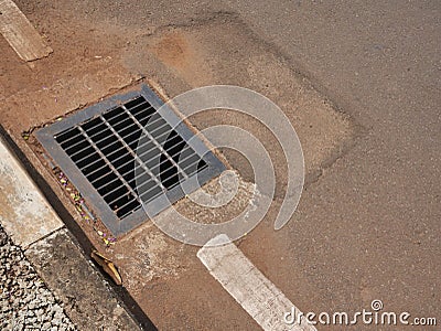 Full view of a storm drain surface water drainage systems Stock Photo