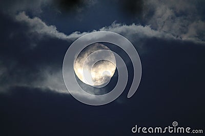 Full white moon behind clouds Stock Photo