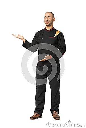 Fullbody portrait of Afro American professional cook presenting Stock Photo