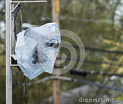 Fully automated timing system camera covered in plastic because of rain Stock Photo
