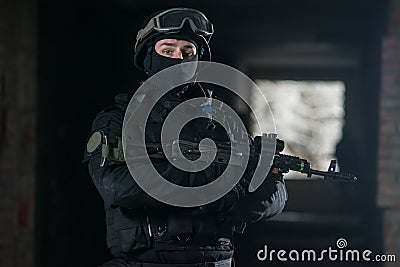 Fully equipped military men with automatic weapons Stock Photo