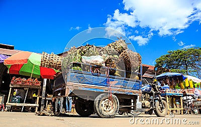 Fully loaded pickup motor with fruits on a market Stock Photo