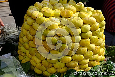 Fully matured yellow sweet fig fruit stack at fresh fruit market Stock Photo