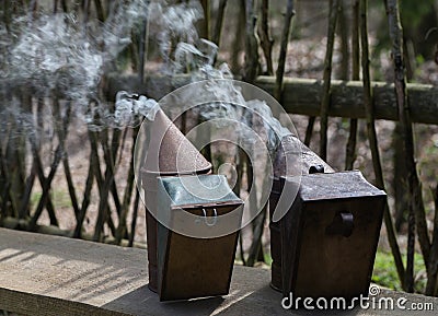 Beekeeper inverter close-up. Chimney in the apiary and hive Stock Photo