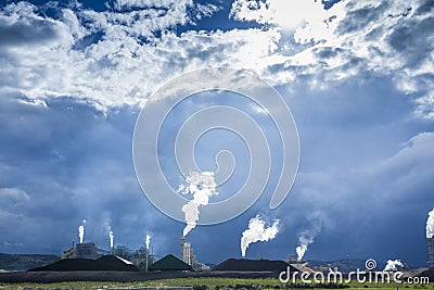 Fuming chimneys of a factory Stock Photo