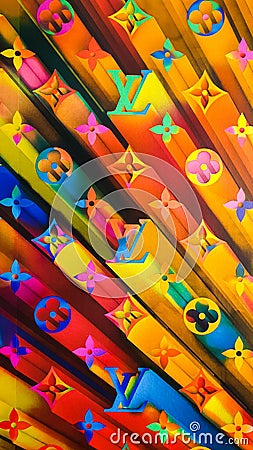 2019 fun and bold window display rainbow monogram wallpaper background at the Louis Vuitton Flagship Store Editorial Stock Photo