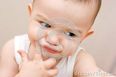 Fun caucasian baby with finger Stock Photo