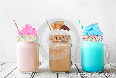 Cotton candy and smores summer milkshakes in mason jar glasses against a white background Stock Photo