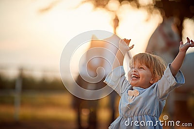 Fun on countryside,smiling girl on horse farm Stock Photo