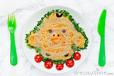 Fun food idea for kids - cute yellow chicken rice noodles Stock Photo