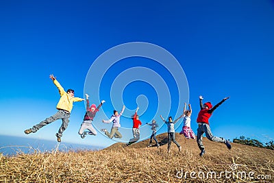 Fun Group of Young People Jumping Outdoors Editorial Stock Photo