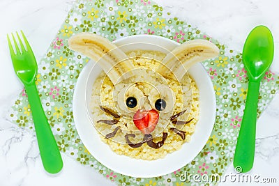 Fun and healthy breakfast idea for kids - Easter bunny millet porridge Stock Photo