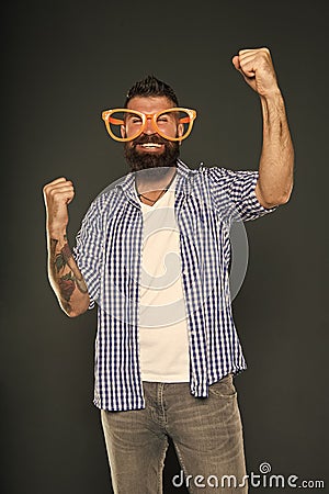 Only fun on my mind. Entertaining himself. Bearded man wearing party glasses. Funny hipster in extravagant glasses Stock Photo