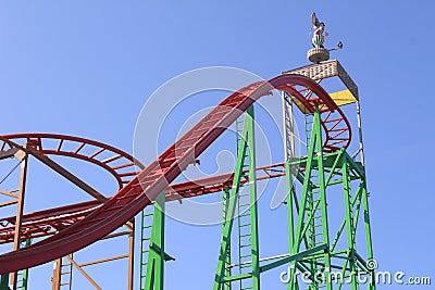 Fun Parc with the roller-coaster - isolated, blue sky in the background Stock Photo