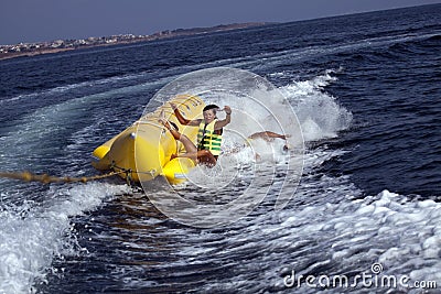 Fun riding banana boat. Stock Photo