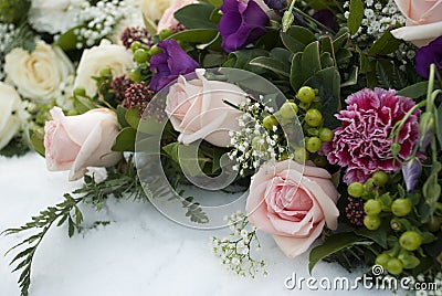 Funeral flowers in the snow on a cemetery Stock Photo