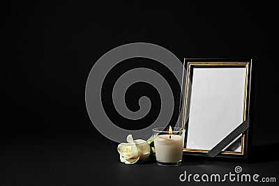 Funeral photo frame with ribbon, white rose and candle on background. Space for design Stock Photo