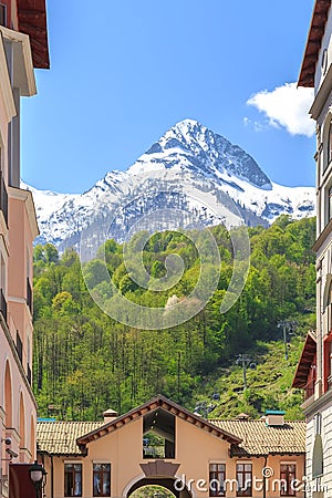 Funicular, green forests and snow-capped mountains in spring Stock Photo