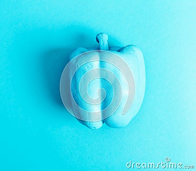 Funky vegetable painted pepper on a blue background Stock Photo