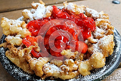 Funnel cake with strawberry topping Stock Photo