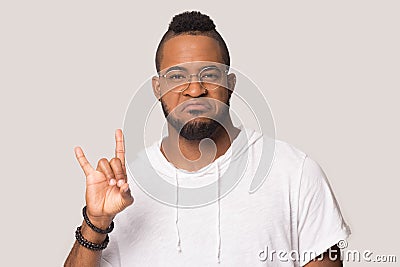 Funny African American man showing cool rock gesture symbol Stock Photo