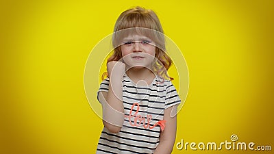 Funny aggressive blonde kid child trying to fight, shaking fist, boxing with expression, punishment Stock Photo