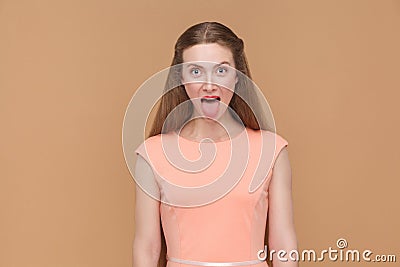 Funny amazed girl shows tongue Stock Photo