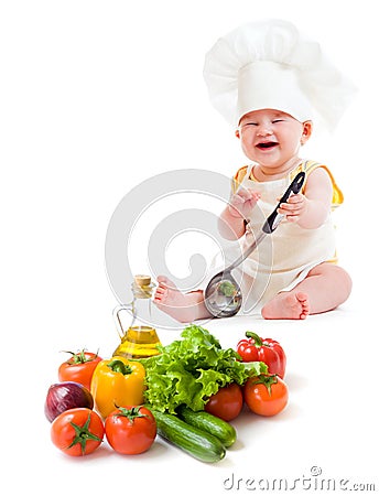 Funny baby boy preparing healthy food Stock Photo