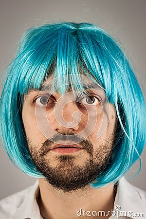 Funny bearded man with wig Stock Photo