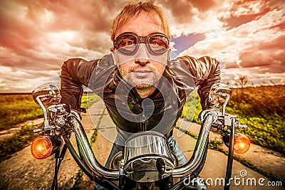 Funny Biker racing on the road Stock Photo